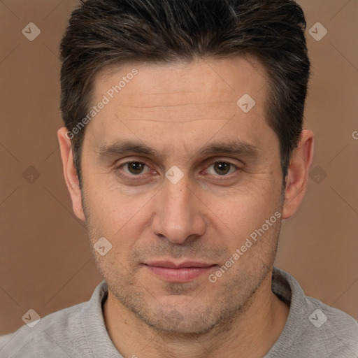 Joyful white adult male with short  brown hair and brown eyes