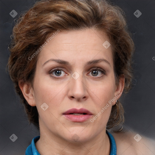 Joyful white adult female with medium  brown hair and blue eyes