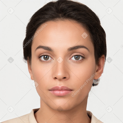 Neutral white young-adult female with short  brown hair and brown eyes