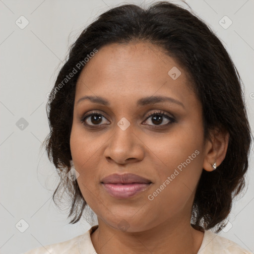 Joyful black adult female with medium  brown hair and brown eyes