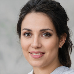 Joyful white young-adult female with medium  brown hair and brown eyes