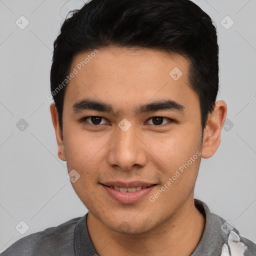 Joyful asian young-adult male with short  black hair and brown eyes