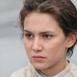 Neutral white young-adult female with short  brown hair and brown eyes