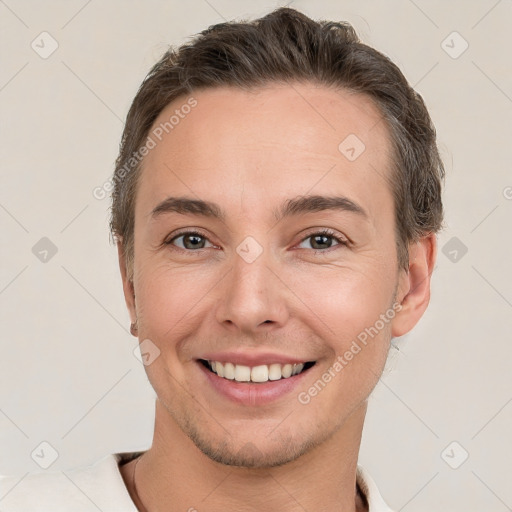 Joyful white young-adult male with short  brown hair and brown eyes