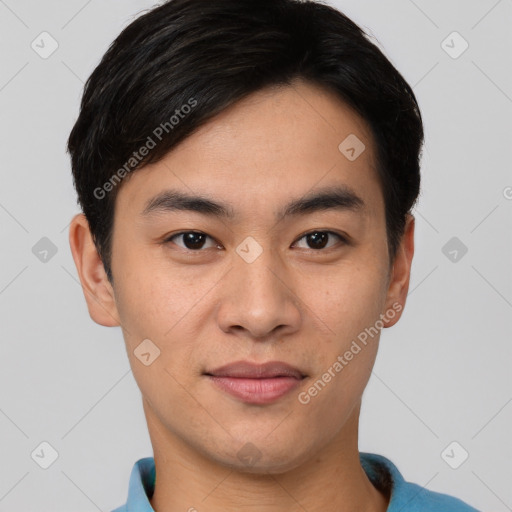 Joyful asian young-adult male with short  black hair and brown eyes