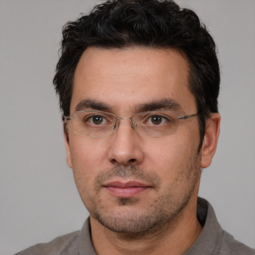 Neutral white adult male with short  black hair and brown eyes