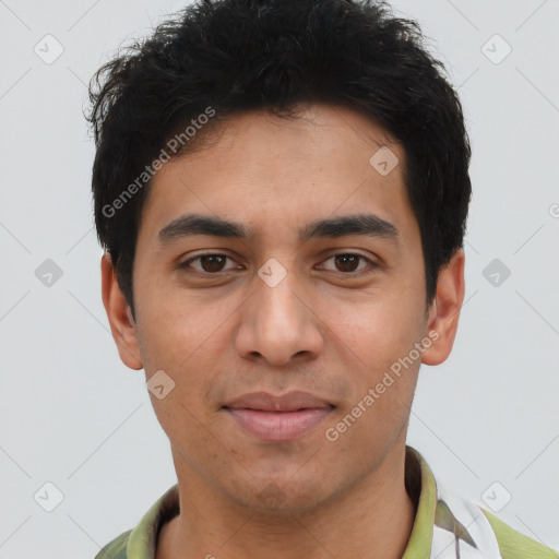 Joyful latino young-adult male with short  brown hair and brown eyes