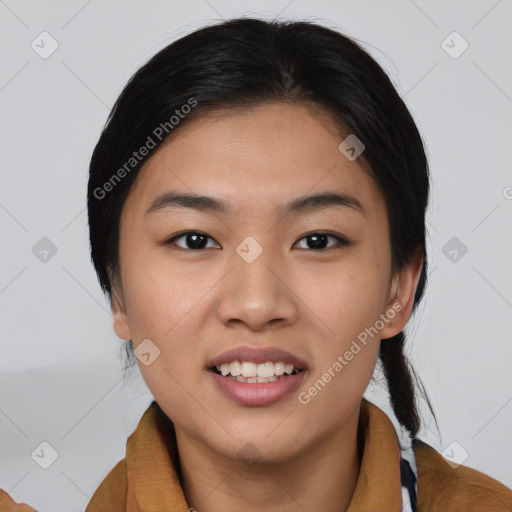 Joyful asian young-adult female with medium  brown hair and brown eyes