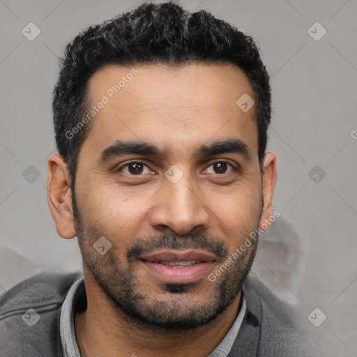 Joyful latino young-adult male with short  black hair and brown eyes