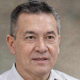 Joyful white middle-aged male with short  brown hair and brown eyes