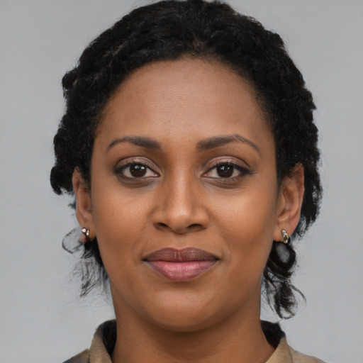 Joyful latino young-adult female with medium  black hair and brown eyes