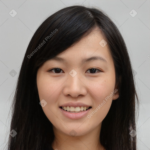 Joyful asian young-adult female with long  brown hair and brown eyes