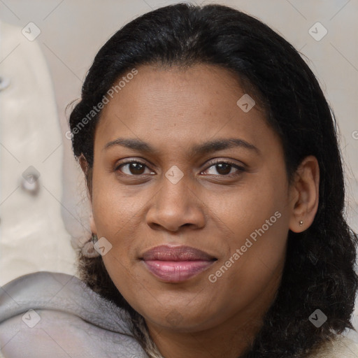 Joyful black adult female with medium  brown hair and brown eyes