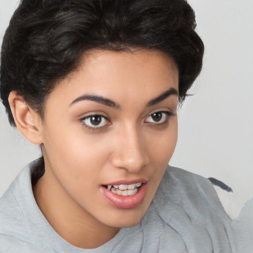 Joyful latino young-adult female with short  brown hair and brown eyes