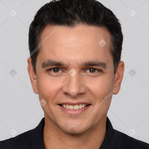 Joyful white young-adult male with short  black hair and brown eyes