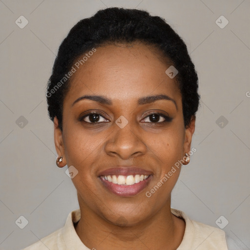 Joyful black young-adult female with short  black hair and brown eyes