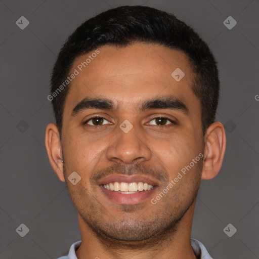 Joyful latino young-adult male with short  brown hair and brown eyes