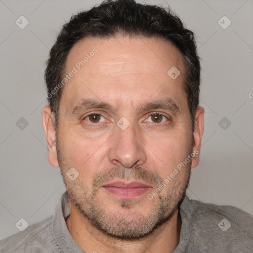 Joyful white adult male with short  brown hair and brown eyes