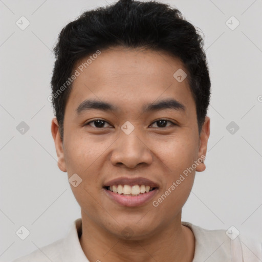 Joyful latino young-adult male with short  brown hair and brown eyes