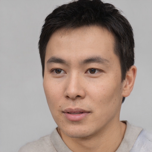 Neutral asian young-adult male with short  black hair and brown eyes