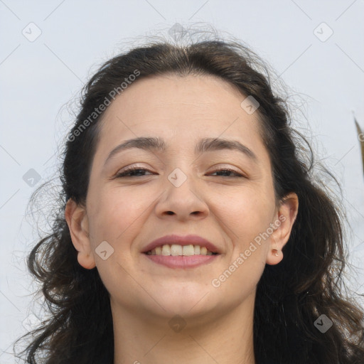 Joyful white adult female with long  brown hair and brown eyes