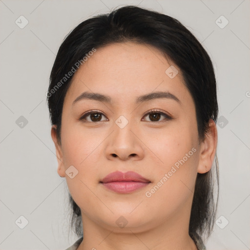 Joyful asian young-adult female with medium  black hair and brown eyes