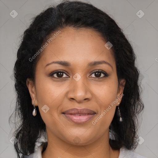 Joyful black adult female with medium  brown hair and brown eyes