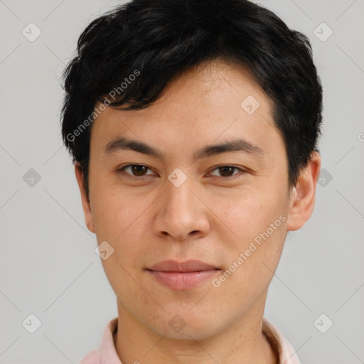 Joyful asian young-adult male with short  brown hair and brown eyes