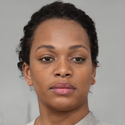 Neutral black young-adult female with short  brown hair and brown eyes