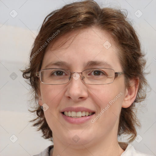 Joyful white adult female with medium  brown hair and blue eyes