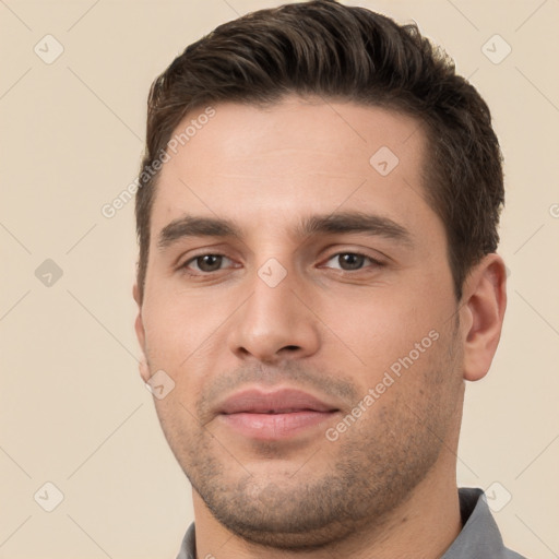 Joyful white young-adult male with short  brown hair and brown eyes