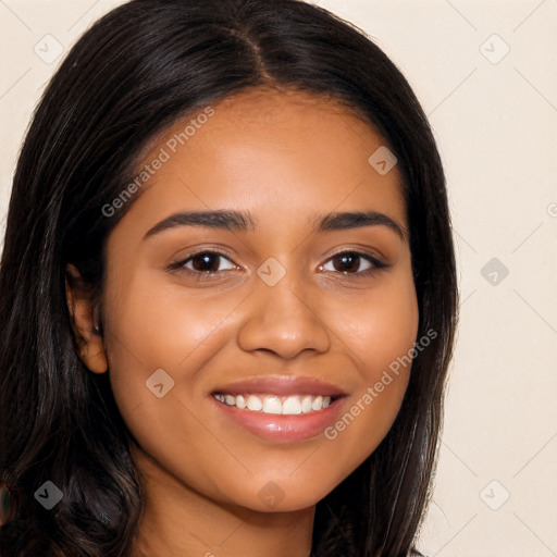 Joyful latino young-adult female with long  black hair and brown eyes