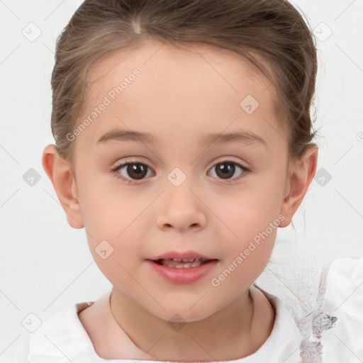 Joyful white child female with short  brown hair and brown eyes