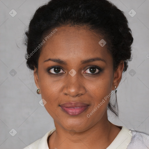 Joyful black young-adult female with short  black hair and brown eyes