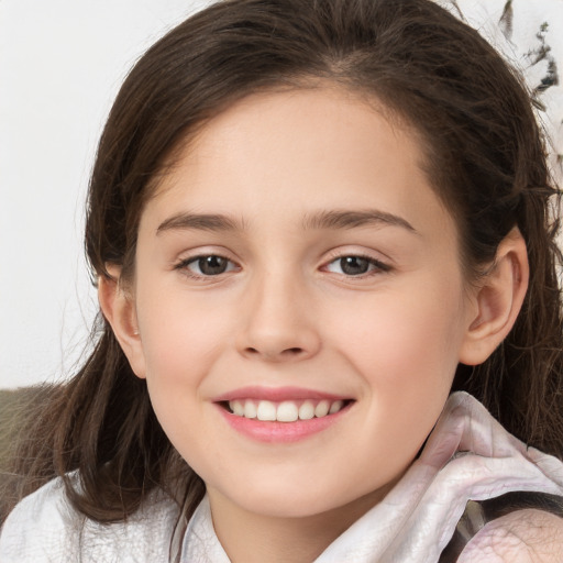 Joyful white child female with medium  brown hair and brown eyes