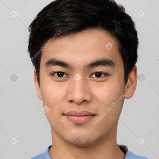 Joyful asian young-adult male with short  brown hair and brown eyes