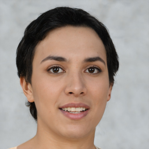 Joyful asian young-adult female with short  black hair and brown eyes