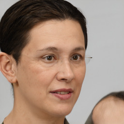 Joyful white adult female with short  brown hair and brown eyes