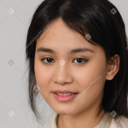 Joyful asian young-adult female with medium  brown hair and brown eyes