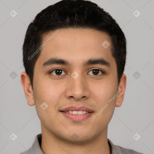 Joyful latino young-adult male with short  black hair and brown eyes