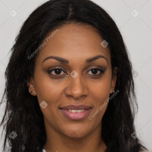 Joyful black young-adult female with long  brown hair and brown eyes