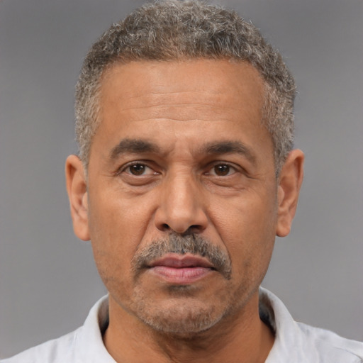 Neutral white middle-aged male with short  gray hair and brown eyes