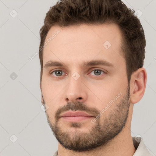 Neutral white young-adult male with short  brown hair and brown eyes