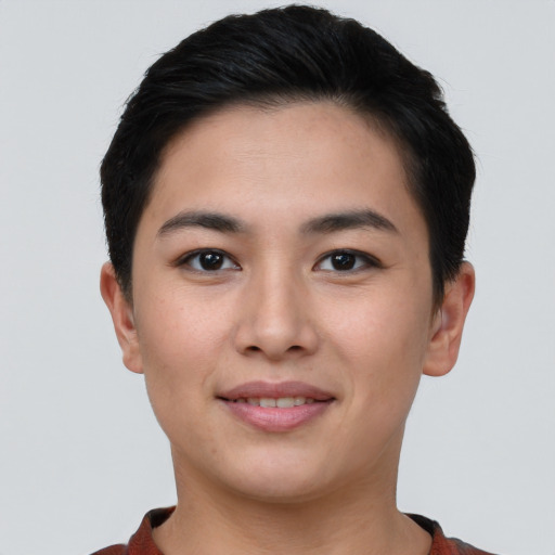 Joyful asian young-adult female with short  black hair and brown eyes