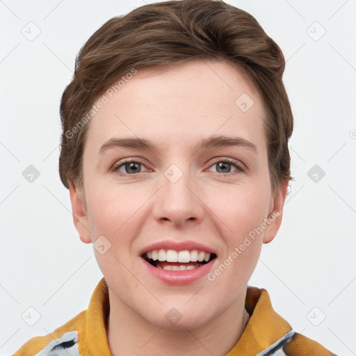 Joyful white young-adult female with short  brown hair and grey eyes