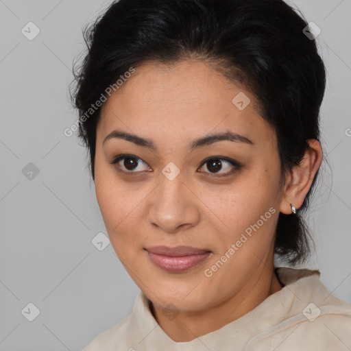 Joyful latino young-adult female with medium  brown hair and brown eyes