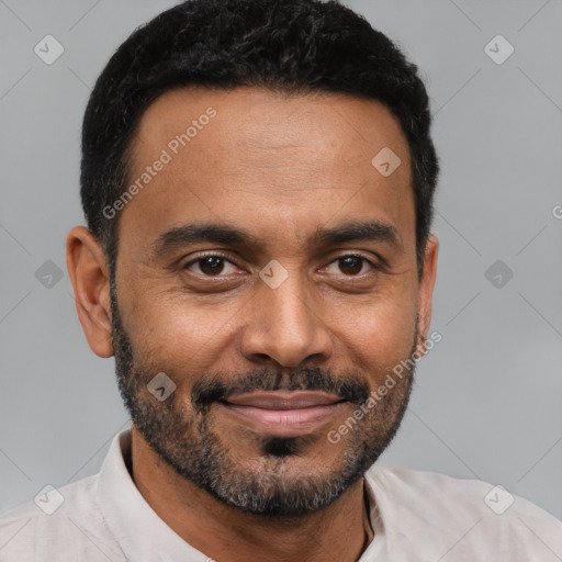 Joyful black young-adult male with short  brown hair and brown eyes