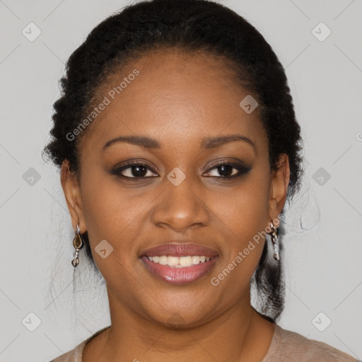 Joyful black young-adult female with long  brown hair and brown eyes