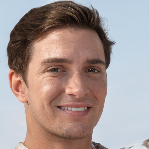 Joyful white adult male with short  brown hair and grey eyes