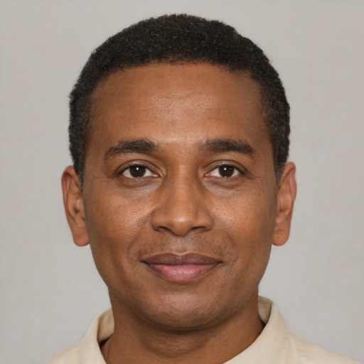 Joyful latino adult male with short  black hair and brown eyes